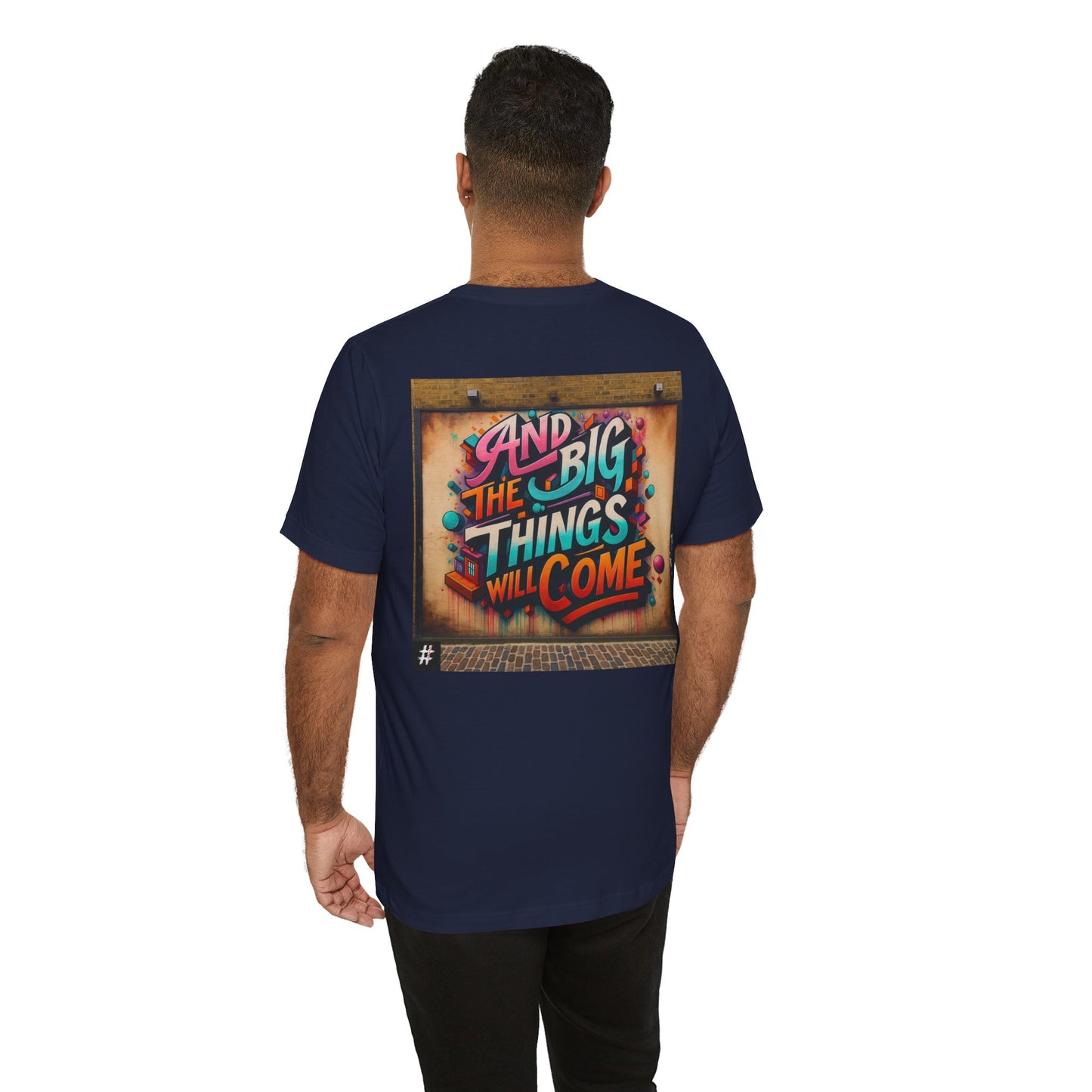A man wearing a dark blue Unisex ‘Sweat the Small Things’ graphic tee — bold typography shirt highlighting that small details and daily discipline create the foundation for every big achievement.