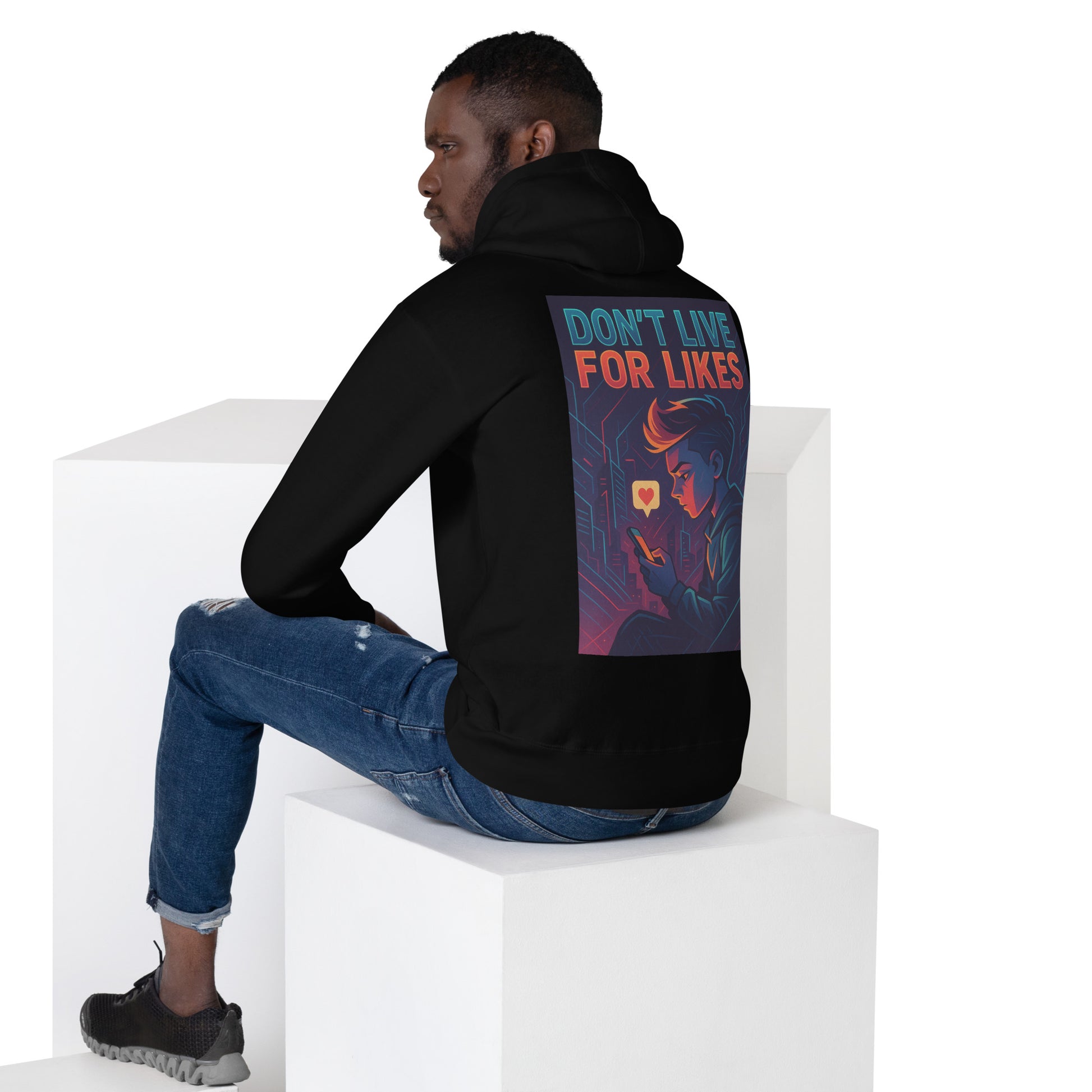 A man wearing a Don’t Live for Likes slogan hoodie, black back view