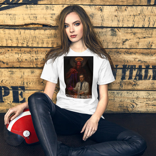 A woman wearing a white Unisex The Lie We Worship graphic tee — provocative design of devil controlling doctor puppet, confronting blind faith and false narratives.